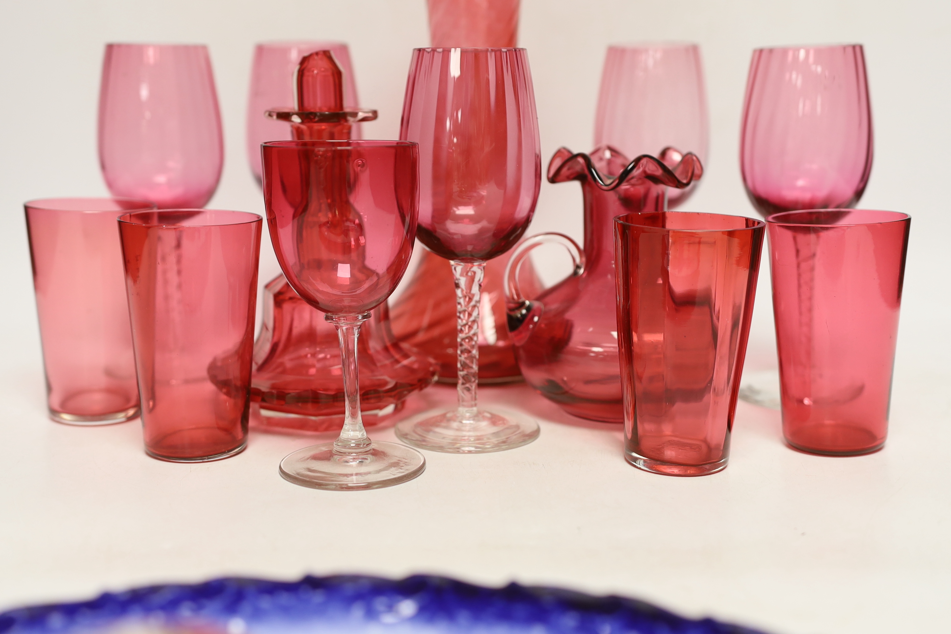 A Royal Crown Derby oval wall plate, a tortoise figure model and thirteen cranberry glass items including wine glasses, a decanter, etc. (15)